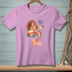 Pink t-shirt with cartoon mermaid and pufferfish, reading "Well, somebody's puffy."