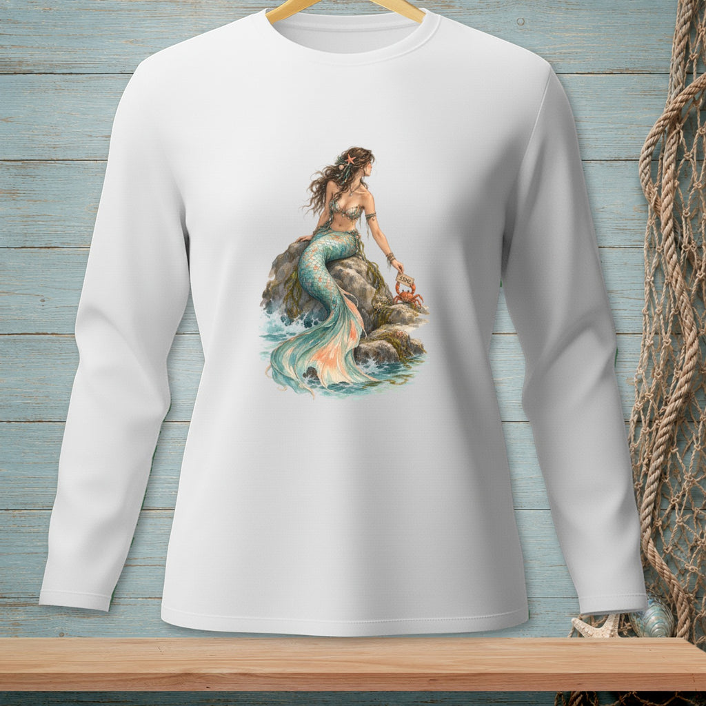 White long sleeve shirt with a mermaid sitting on a rock holding a crab.