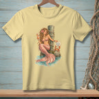 Yellow t-shirt with illustration of a mermaid holding a drink, a crab, and text.