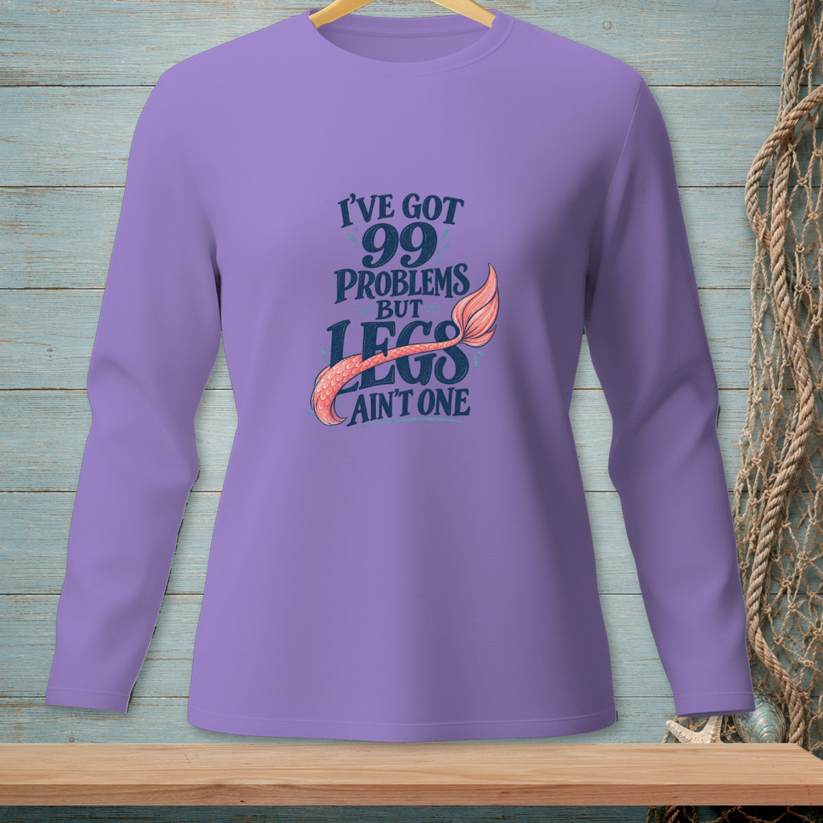 Purple long-sleeve shirt with text "I've got 99 problems but legs ain't one" and mermaid tail.
