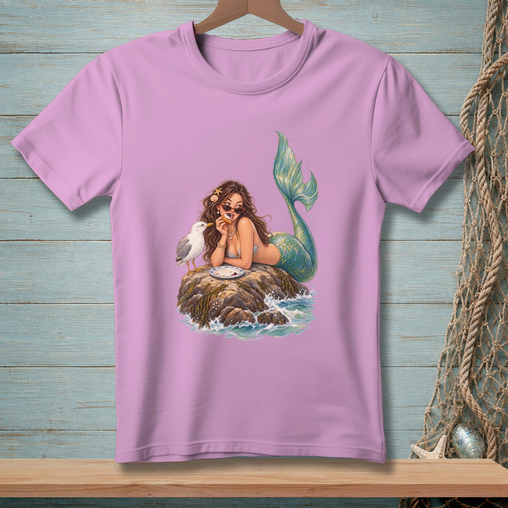 Mermaid with sunglasses eating pizza on a rock with a seagull and waves.