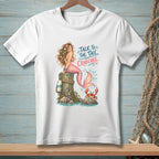 White t-shirt with mermaid and crab graphic that says "Talk to the tail, Crabcake."