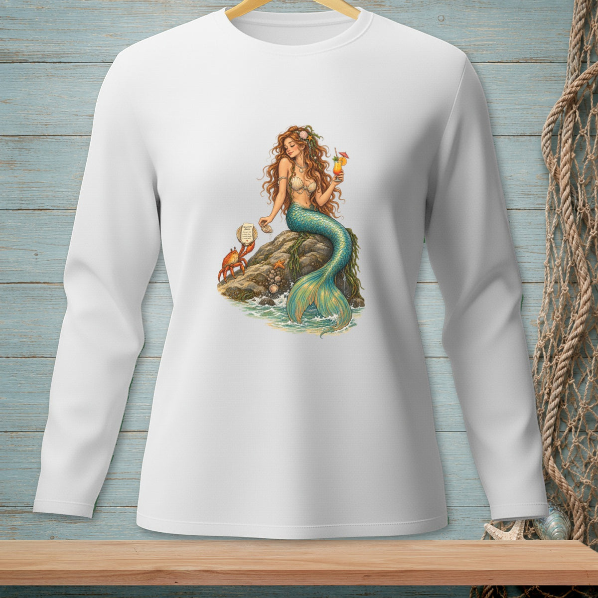 White long-sleeve shirt with a mermaid, crab, and cocktail printed on the chest.