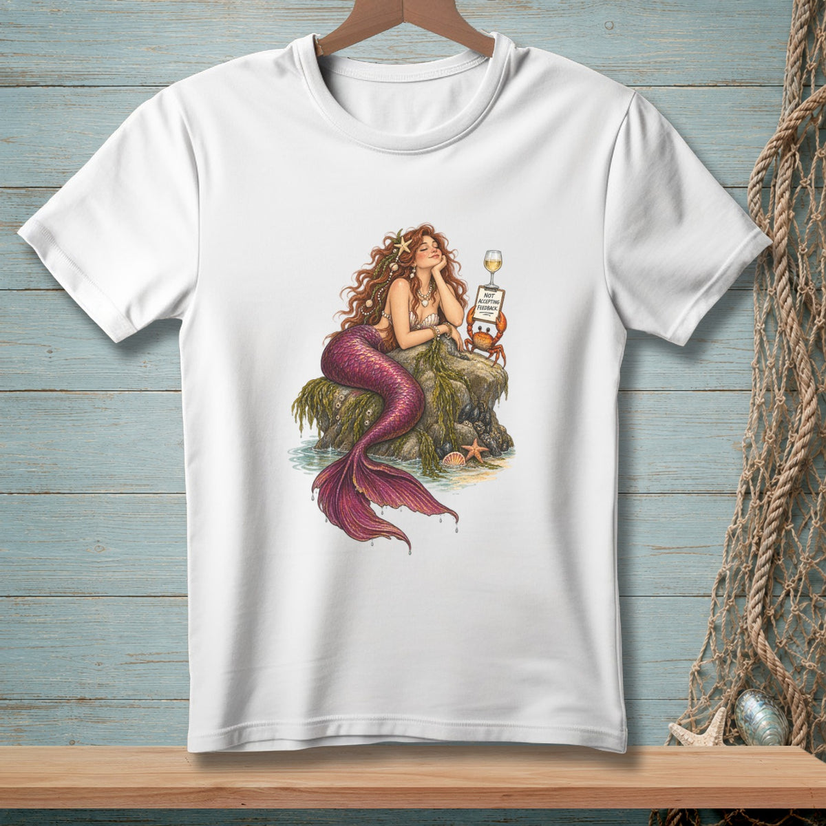 Illustration of mermaid with purple tail resting on rocks near a sign saying "NOT ACCEPTING FEEDBACK".
