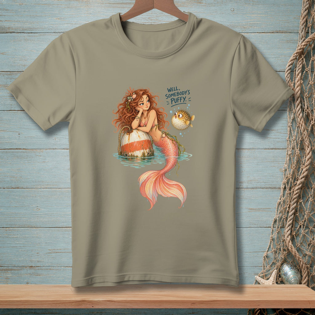 T-shirt graphic of a mermaid with text "Well, somebody's puffy."