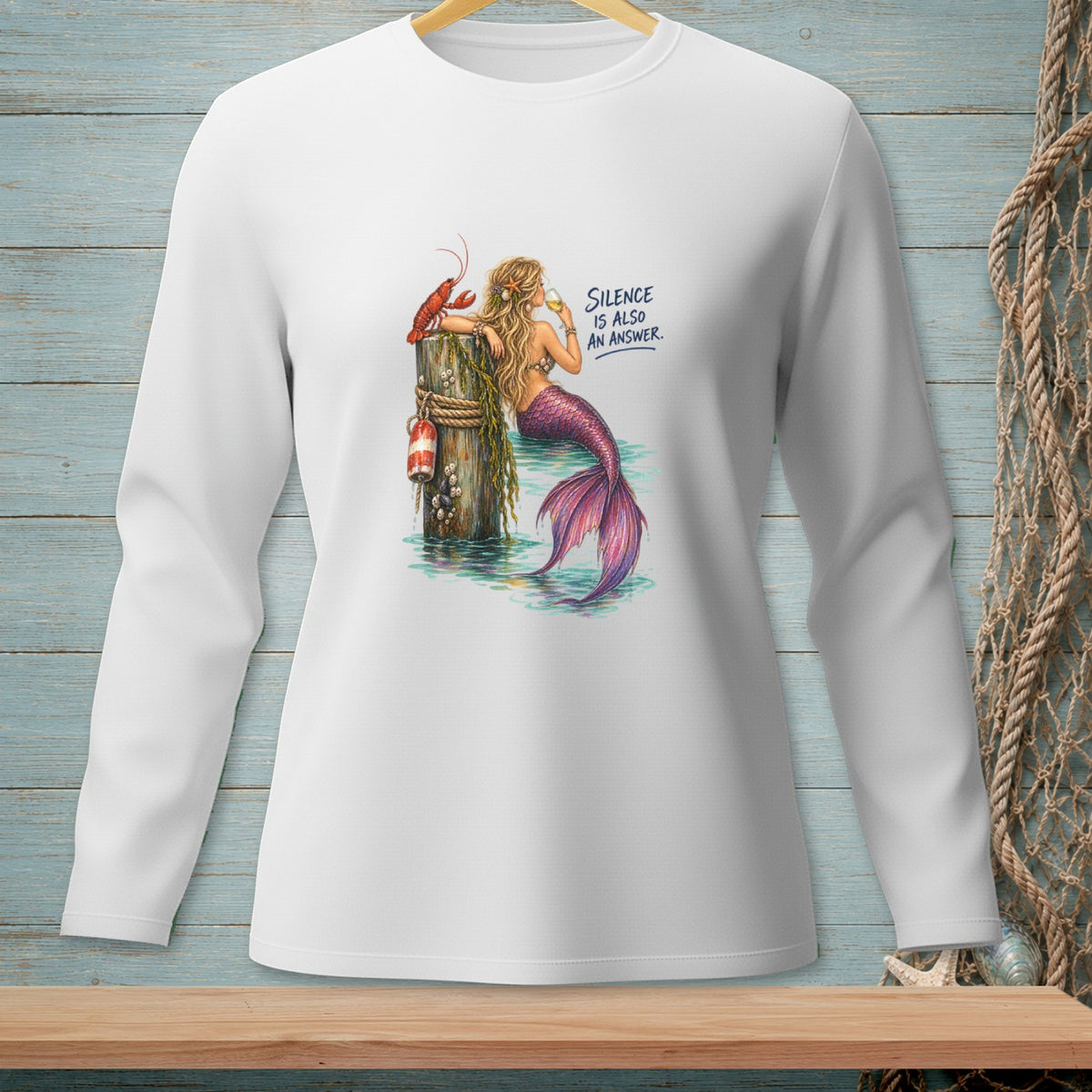White long sleeve shirt with mermaid, lobster, and text "Silence is also an answer".