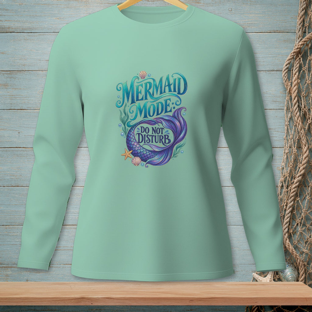 Mint long-sleeve shirt with "Mermaid Mode: Do Not Disturb" graphic and mermaid tail.