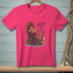 Pink t-shirt with a mermaid on a rock and an octopus with grooming tools.