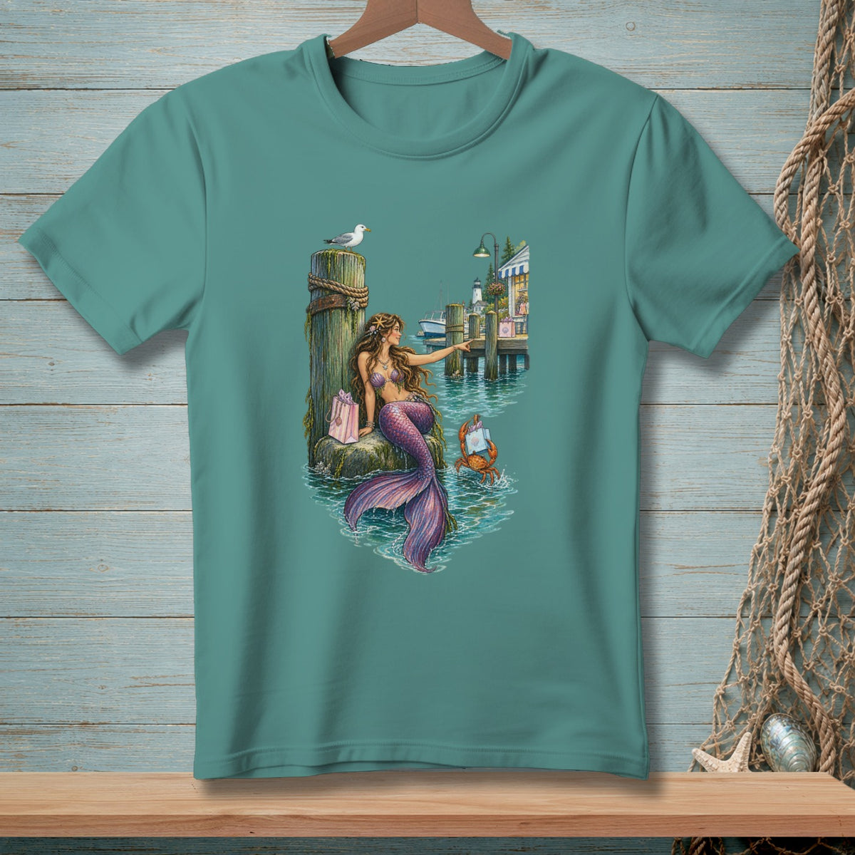 Mermaid with pink gift bag on dock with crab, seagull, and lighthouse.