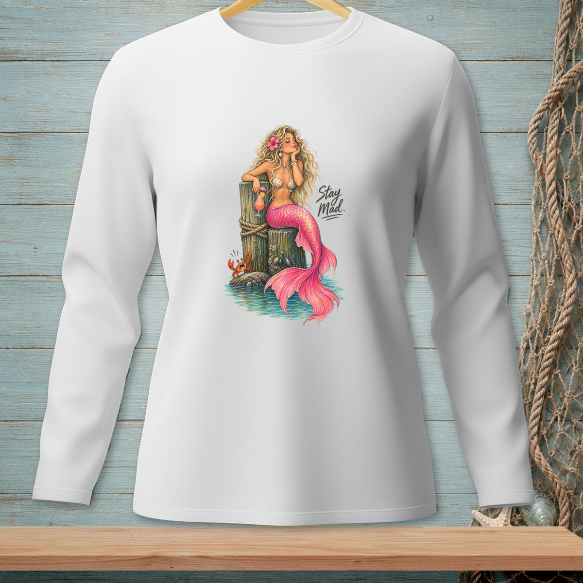 Illustration of a mermaid with a pink tail and the text "Stay Mad."