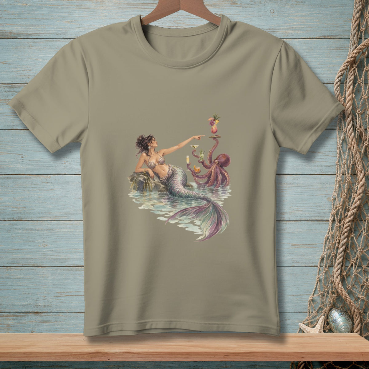 A mermaid and octopus holding drinks on a rock in the water.