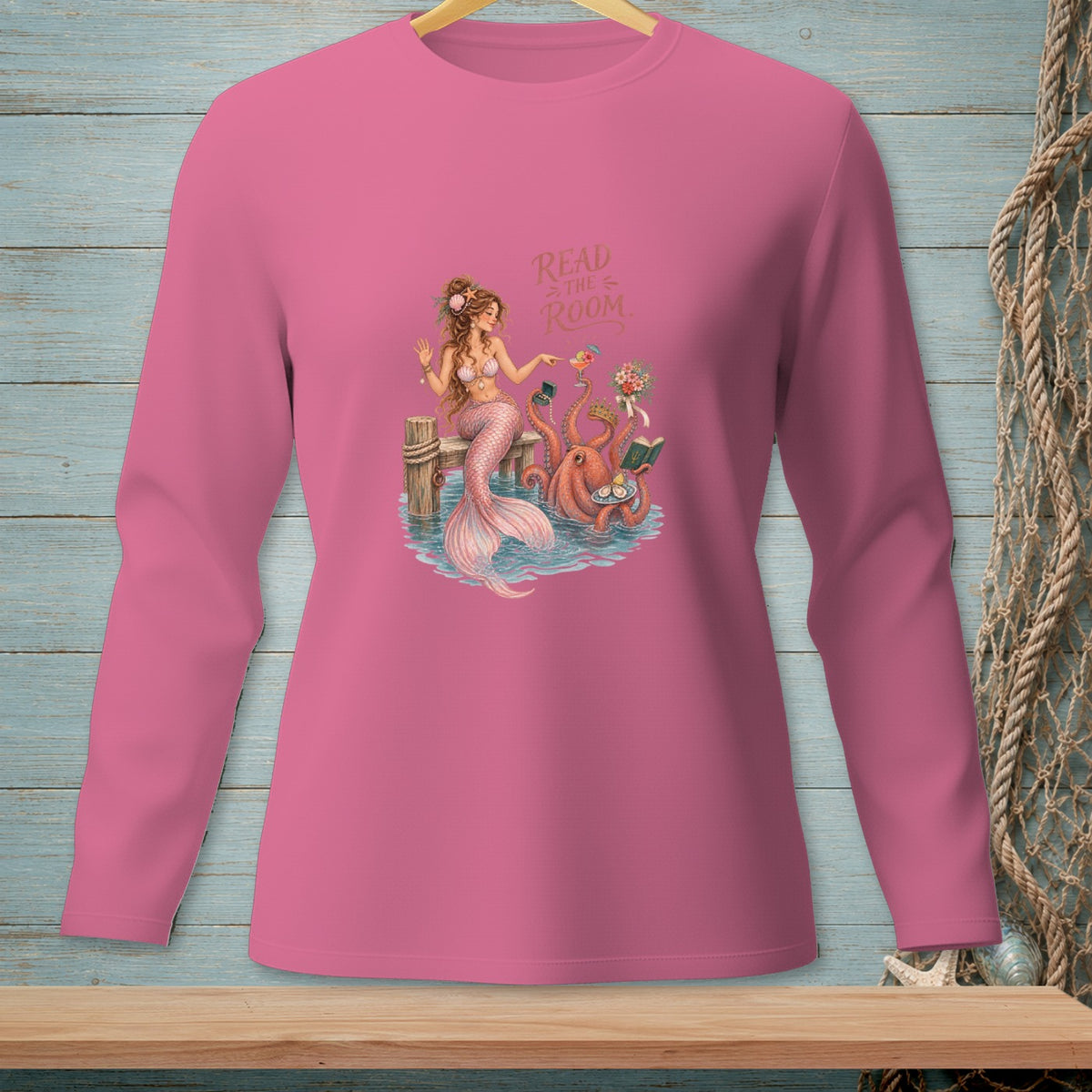 Pink long-sleeve shirt with mermaid and octopus reading books, text "Read the Room."