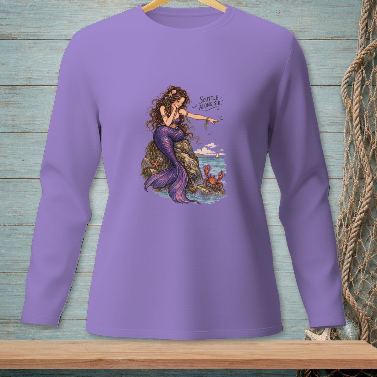 Purple long-sleeved shirt with a mermaid, crab, and text "Scuttle Along, Sir."