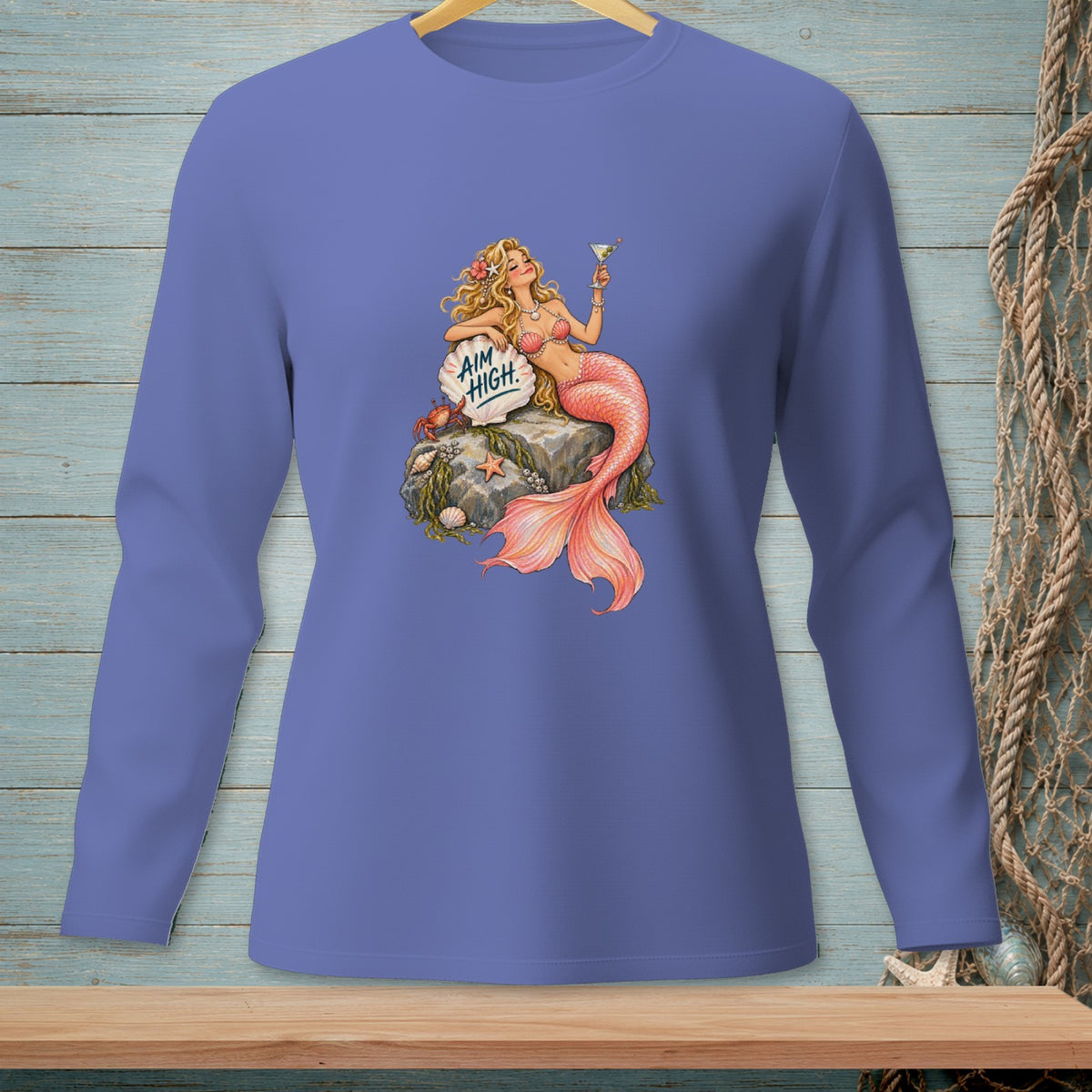 Mermaid with drink sitting on rock with "Aim High" text and a crab.