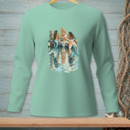 Three mermaids sit on a dock, enjoying a meal with reflections in the water.