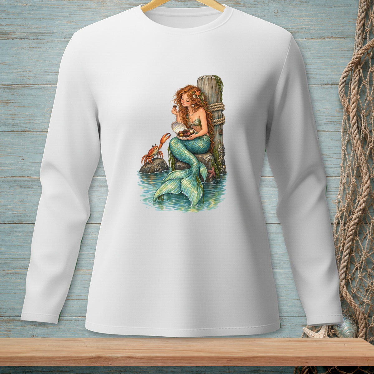 Mermaid with red hair holding chocolates in a seashell with a crab.