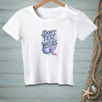 White t-shirt with "Don't Test The Waters" text, mermaid tail, and crab graphic.