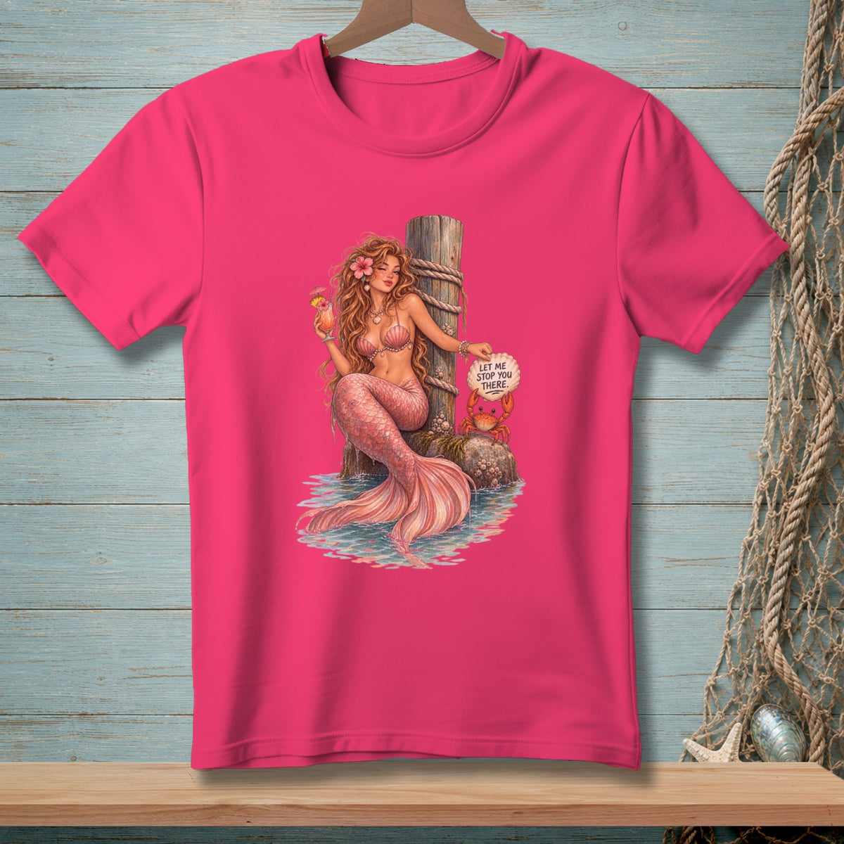 Pink t-shirt with mermaid holding a drink, a crab, and a sign.