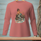 Mermaid with crab and cocktail on a rock surrounded by waves, printed on a pink long-sleeve shirt.