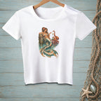 White t-shirt featuring a mermaid and octopus art print with ornate necklace.