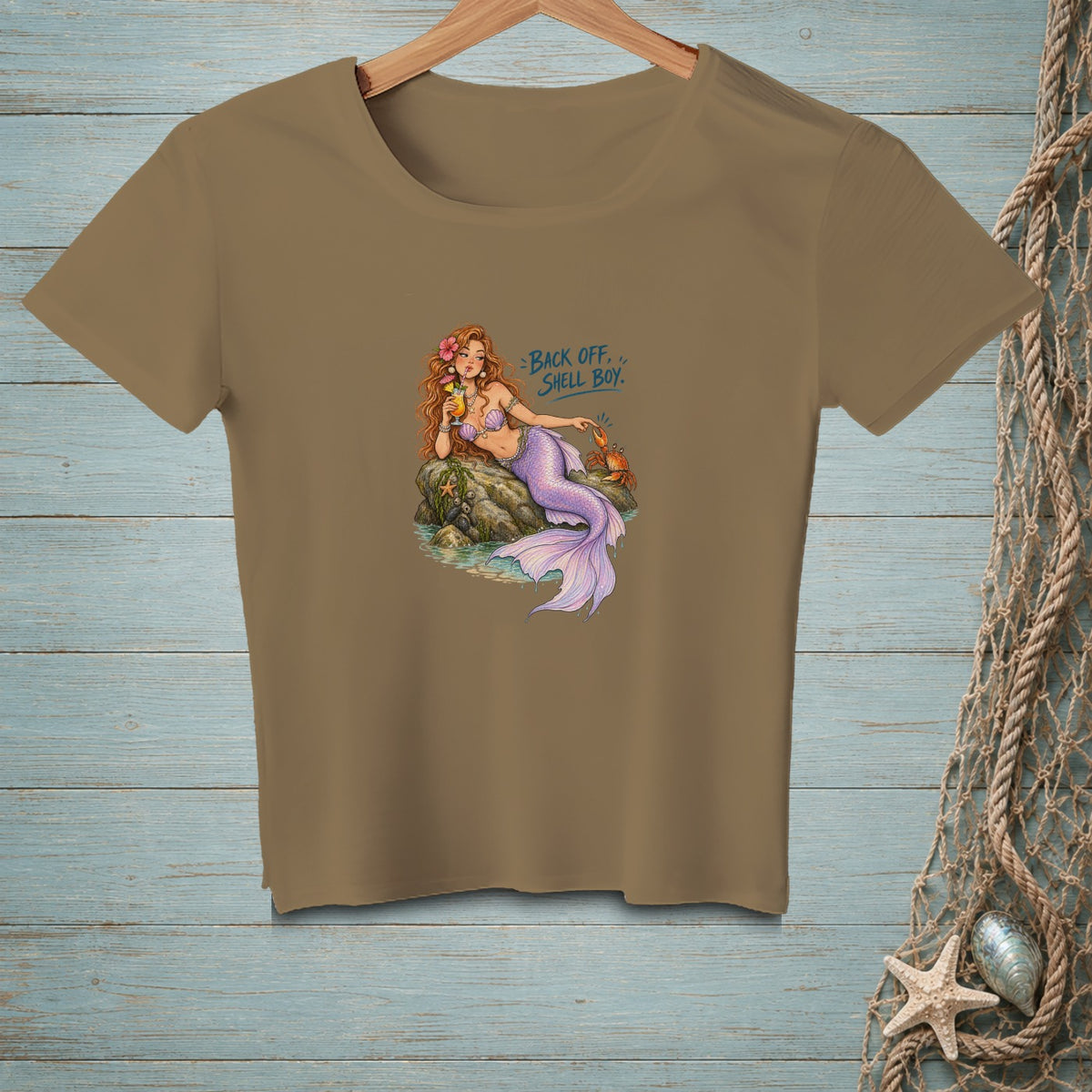 Brown t-shirt with mermaid graphic and text "BACK OFF, SHELL BOY."