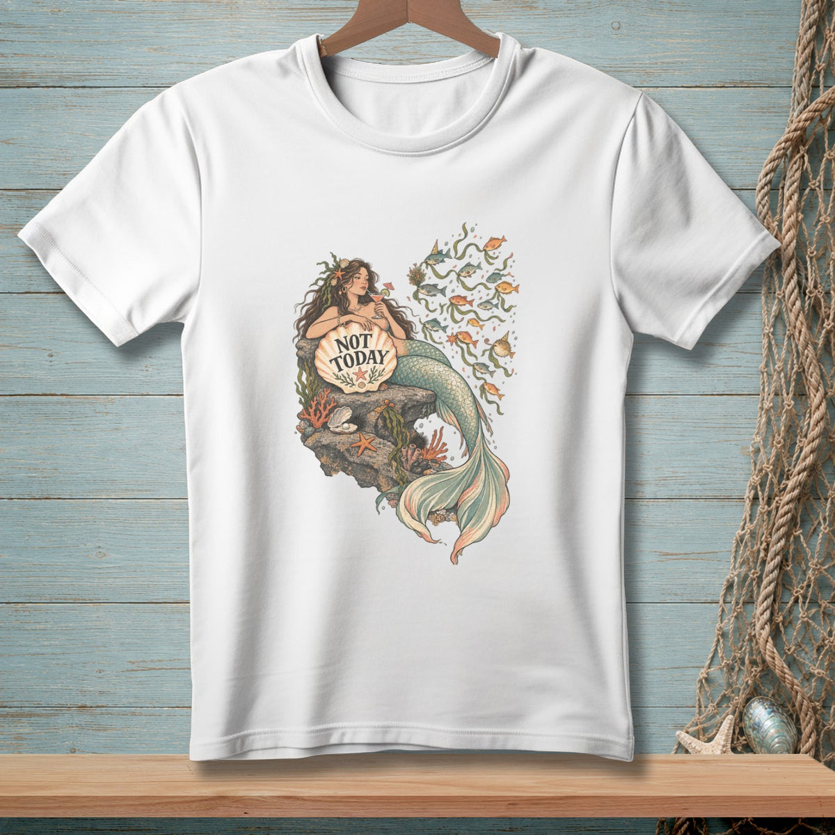 White t-shirt with a mermaid holding a shell that says "Not Today".