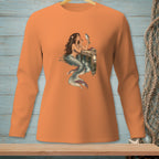Mermaid with fish and makeup applying to her face on an orange long-sleeved shirt.