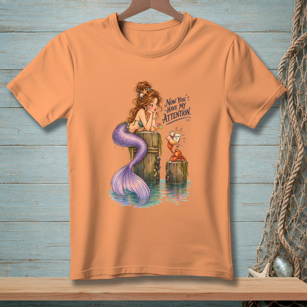 Mermaid on pilings with crab, text "Now you have my attention."