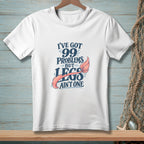 White t-shirt with text "I've got 99 problems but legs ain't one" and a mermaid tail.