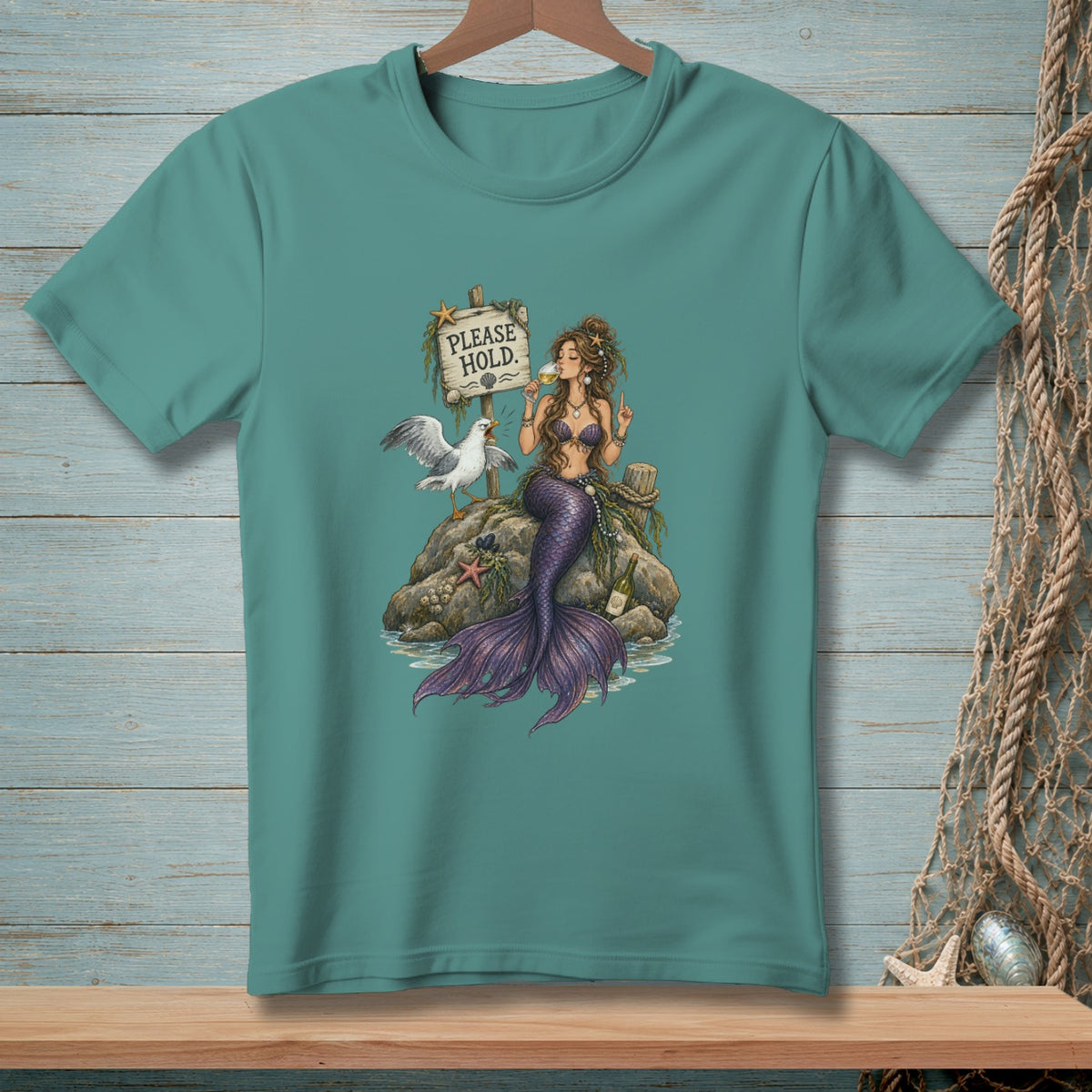 Mermaid and seagull sit on a rock by a "Please Hold" sign, drinking wine.