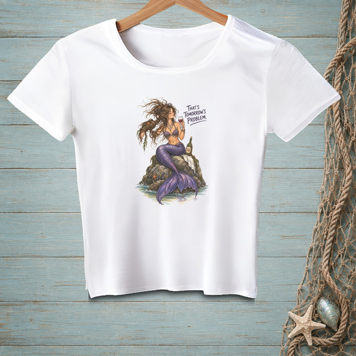 White t-shirt featuring a mermaid with purple tail holding wine and text "That's Tomorrow's Problem."