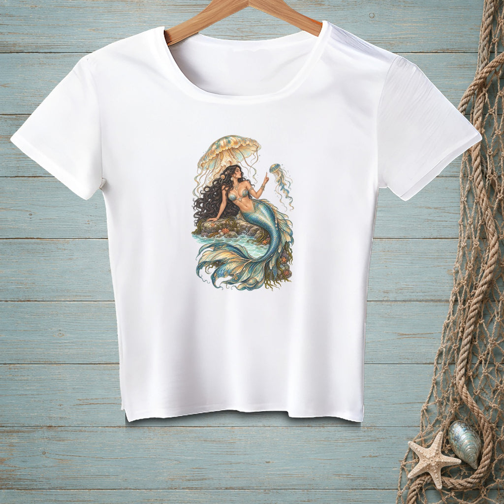 White t-shirt with illustration of a mermaid holding a jellyfish under an umbrella.