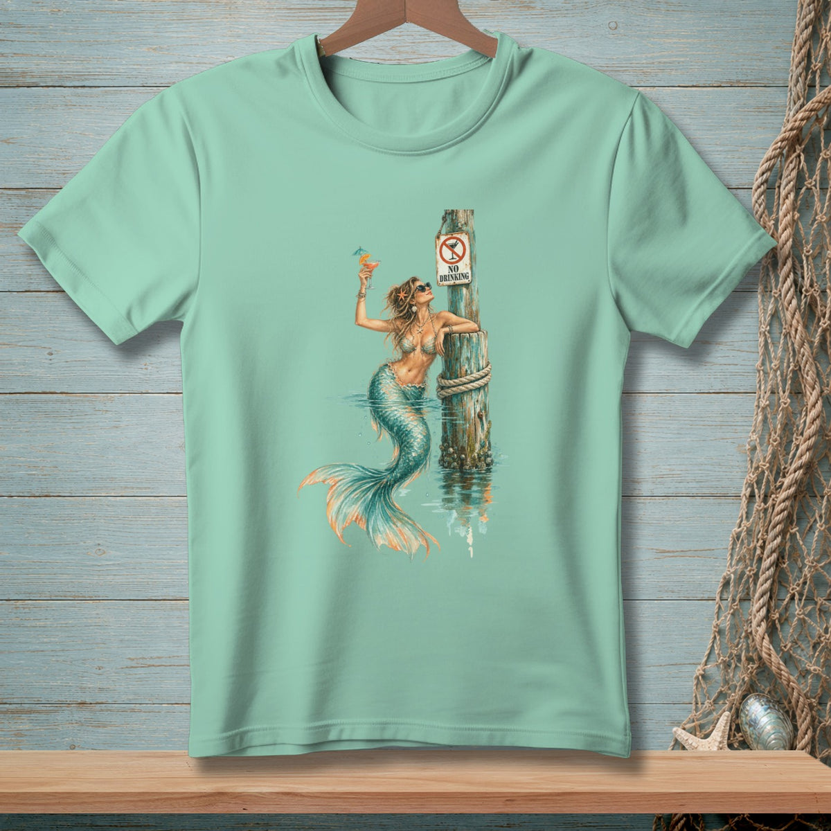 Mermaid with cocktail and "No Drinking" sign on pier post.