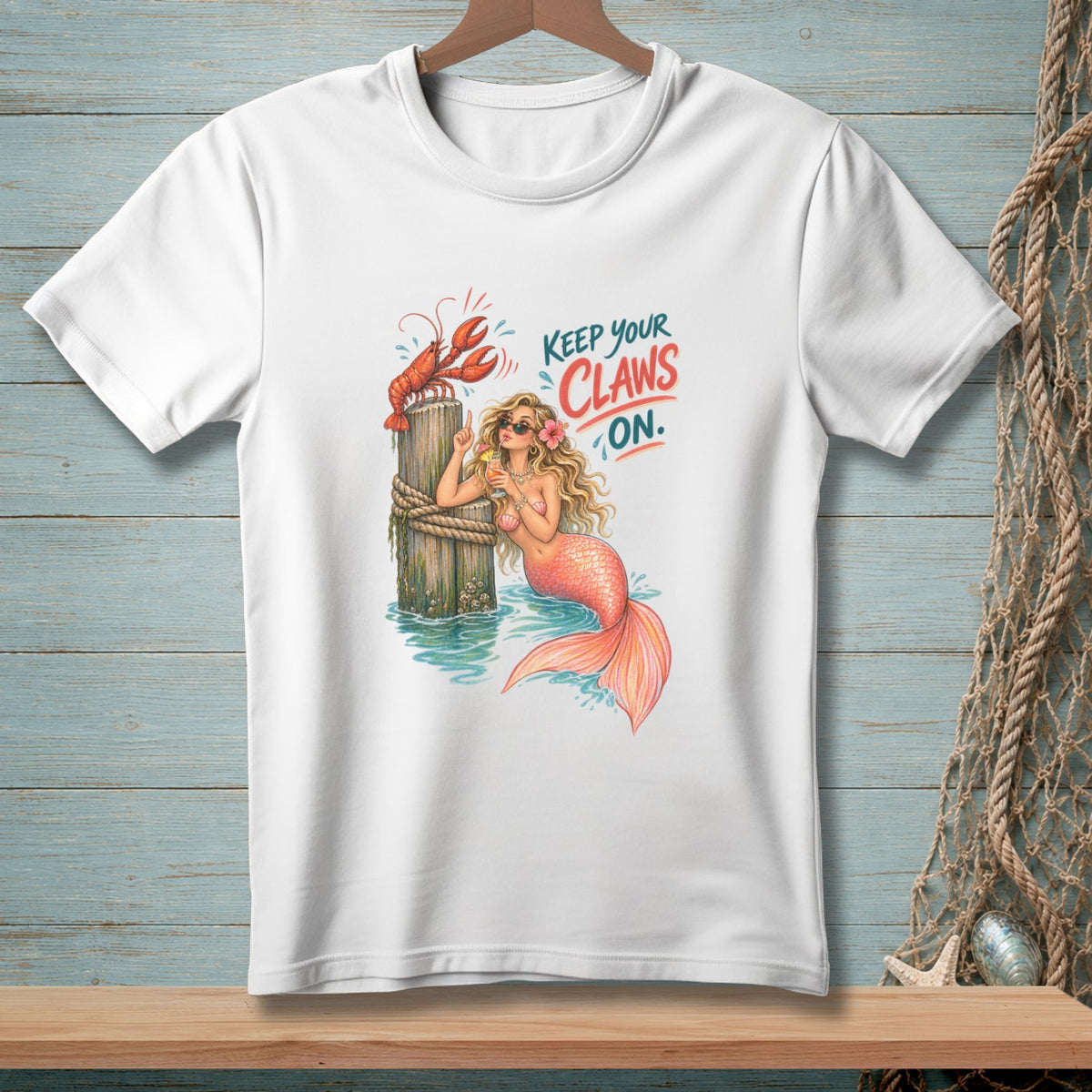 Mermaid with a lobster on a post, text "Keep Your Claws On."