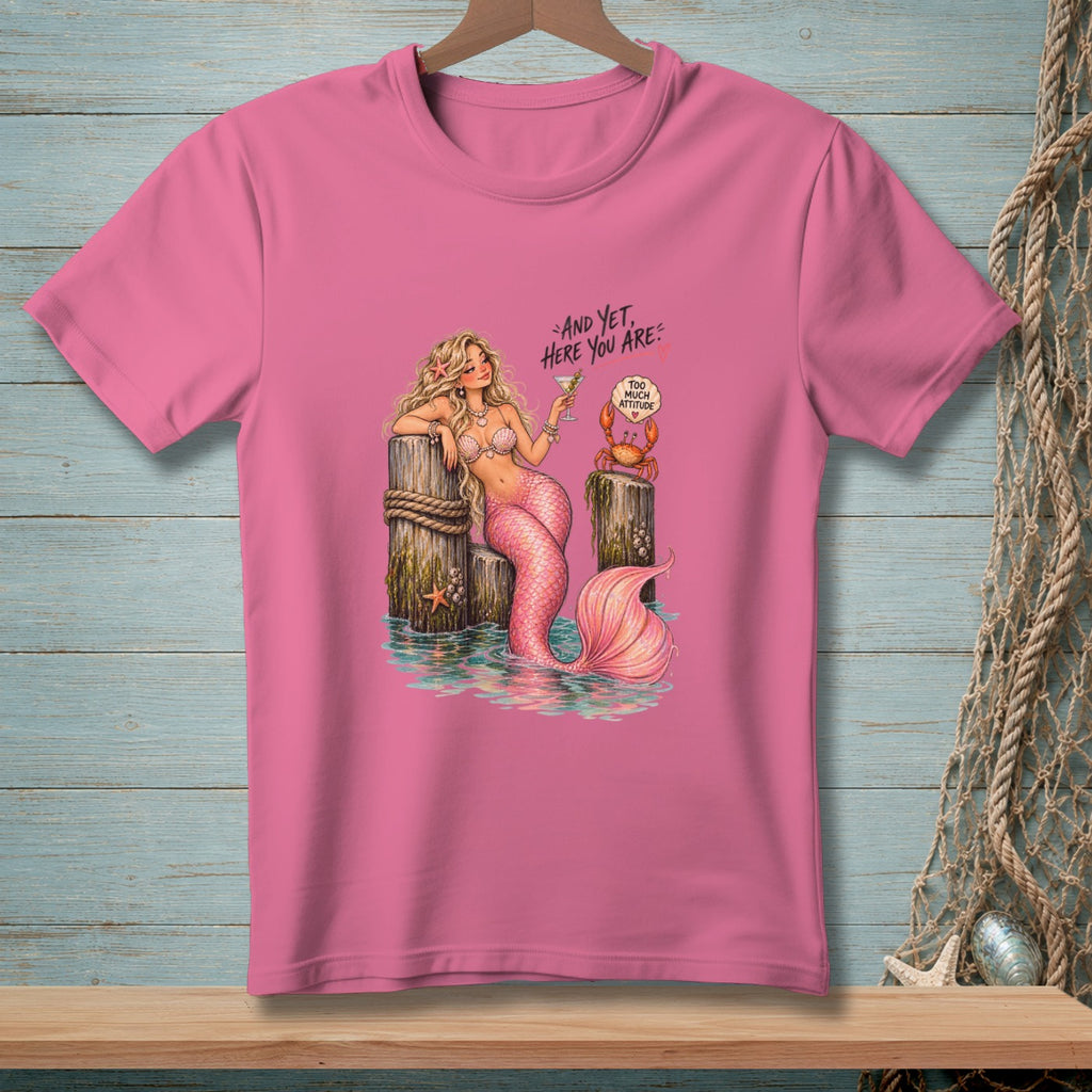 Pink t-shirt with mermaid, crab, and text: "And yet, here you are: Too Much Attitude".