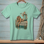 Mint t-shirt with mermaid graphic and text "Whatever Floats Your Boat."