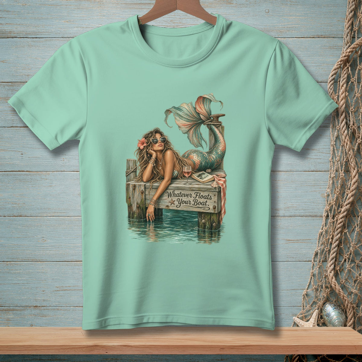 Mint t-shirt with mermaid graphic and text "Whatever Floats Your Boat."