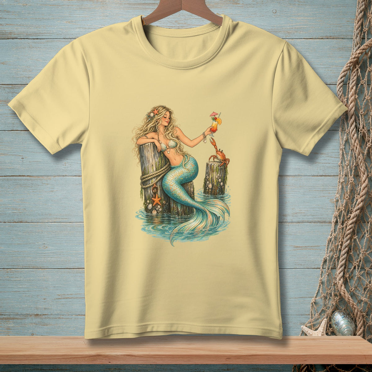Illustration of a blonde mermaid holding a cocktail with a crab on a weathered dock.