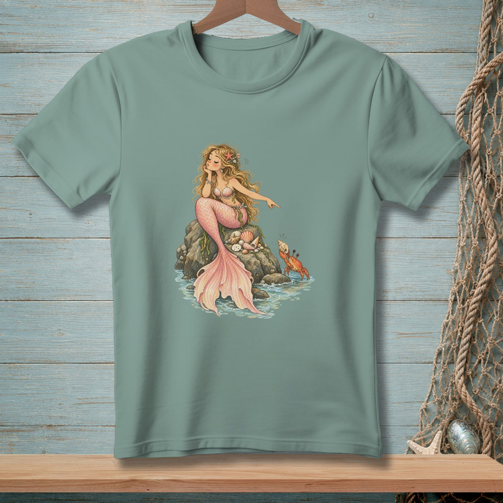 Mermaid sitting on rocks with a crab, printed on a t-shirt.
