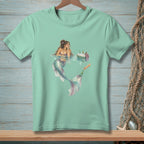 Mint t-shirt with a mermaid reaching for a drink from a cooler.