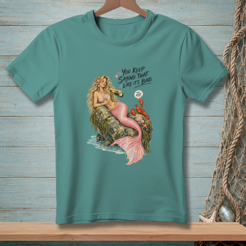 Mermaid pouring champagne on a rock with a lobster and text "You keep saying that like it's bad."