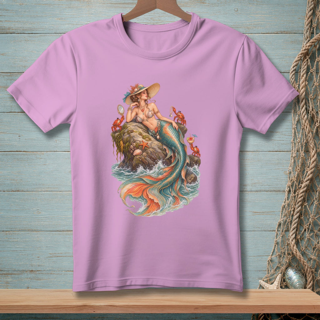 Pink t-shirt with a graphic of a mermaid sitting on a rock surrounded by crabs.