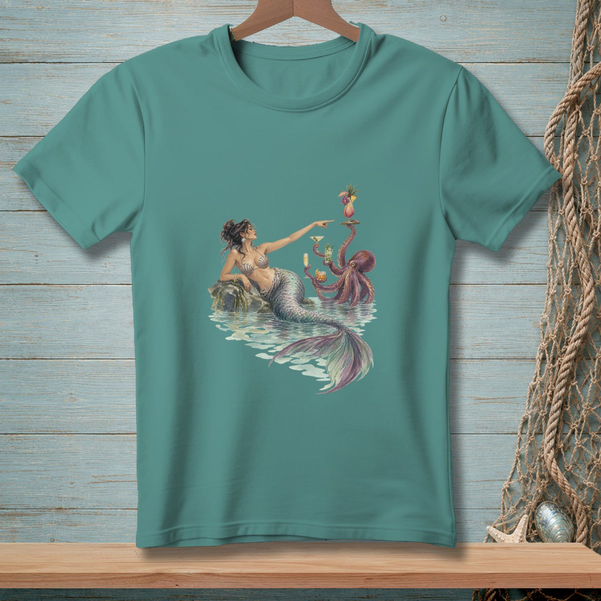Mermaid and octopus serving cocktails on a rock in the water.