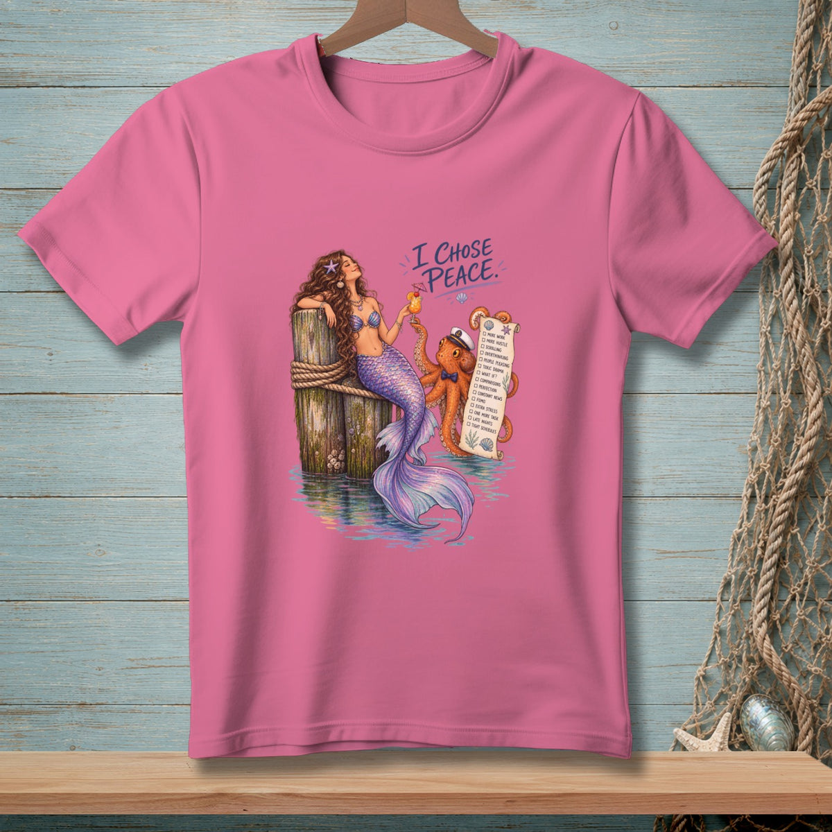 Pink t-shirt with mermaid and octopus holding a "I chose peace" list.