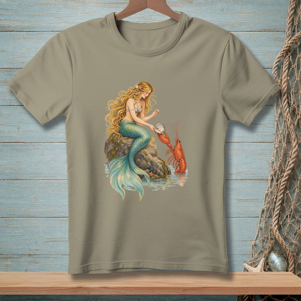 T-shirt with a mermaid holding a pearl next to a lobster on a rock.