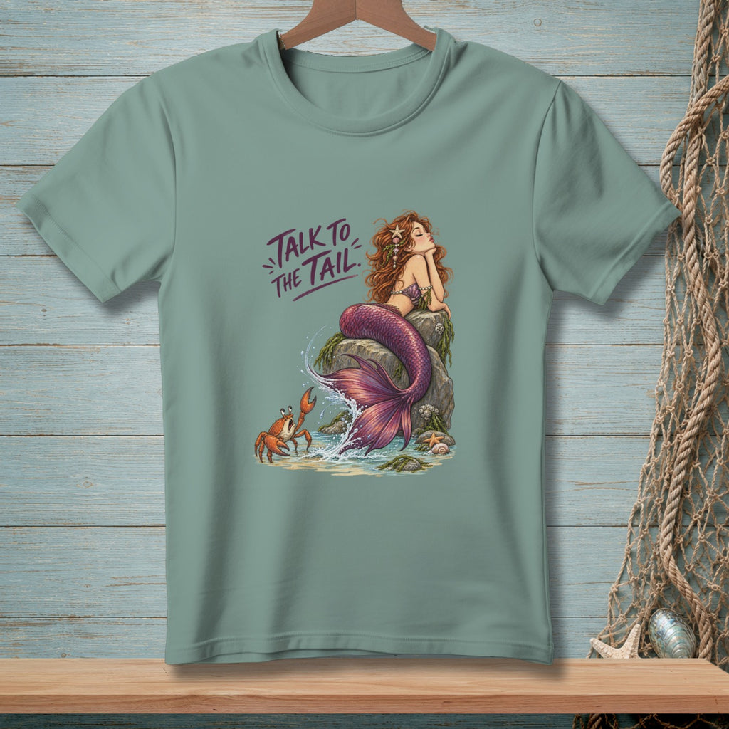 Mermaid on rock with text "Talk to the Tail" and a crab.