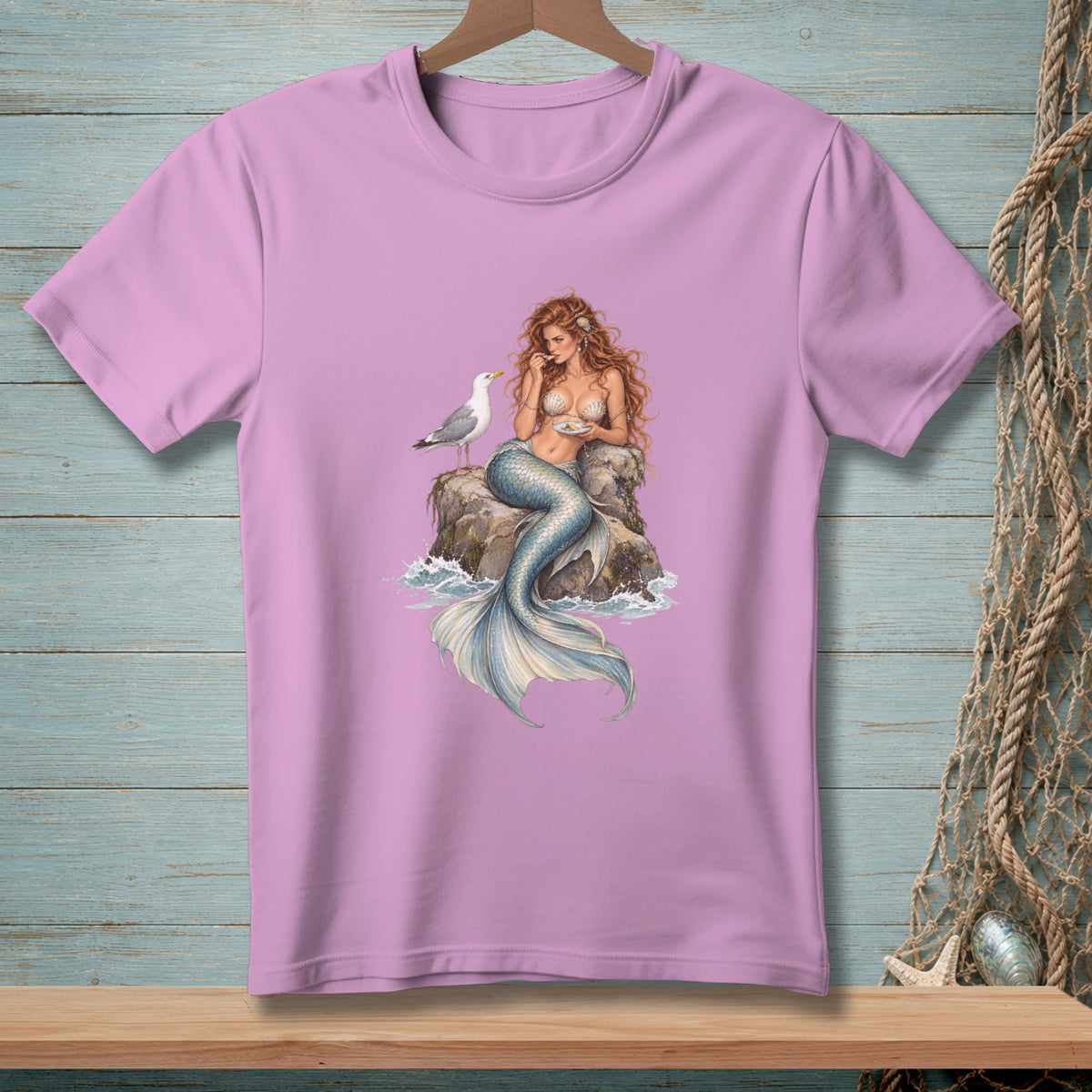 Illustration of a mermaid sitting on a rock with a seagull.