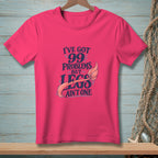 Pink t-shirt with text "I've got 99 problems but legs ain't one" and mermaid tail graphic.