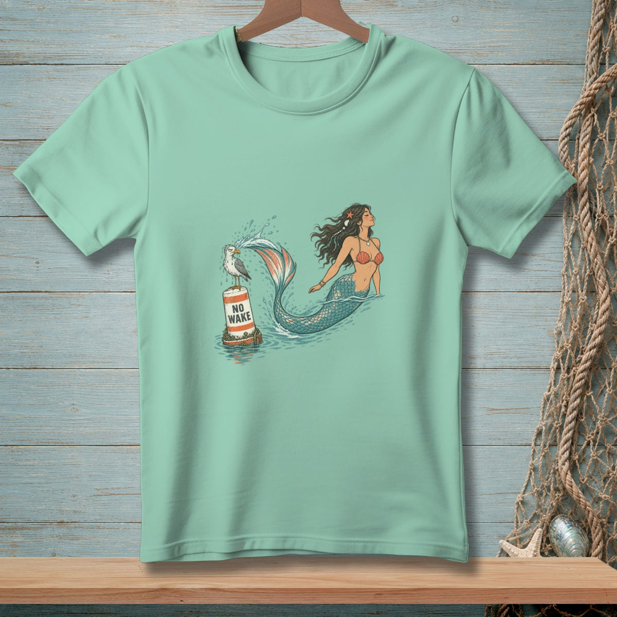 Mermaid swimming near buoy with seagull and text "NO WAKE."