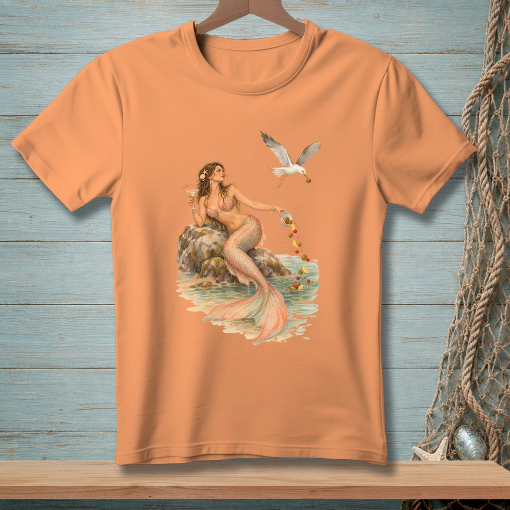 Peach t-shirt with a mermaid holding a drink, by a seagull dropping olives.